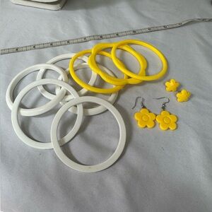 Yellow and white bracelets with earrings